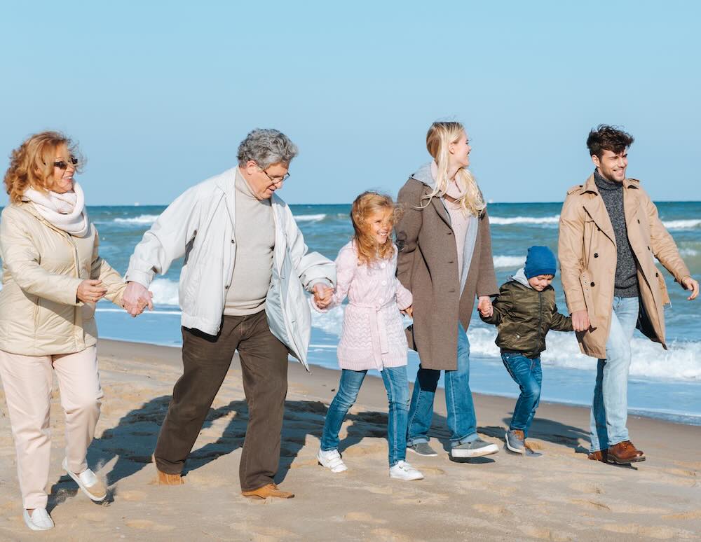 Family walking at seaside
