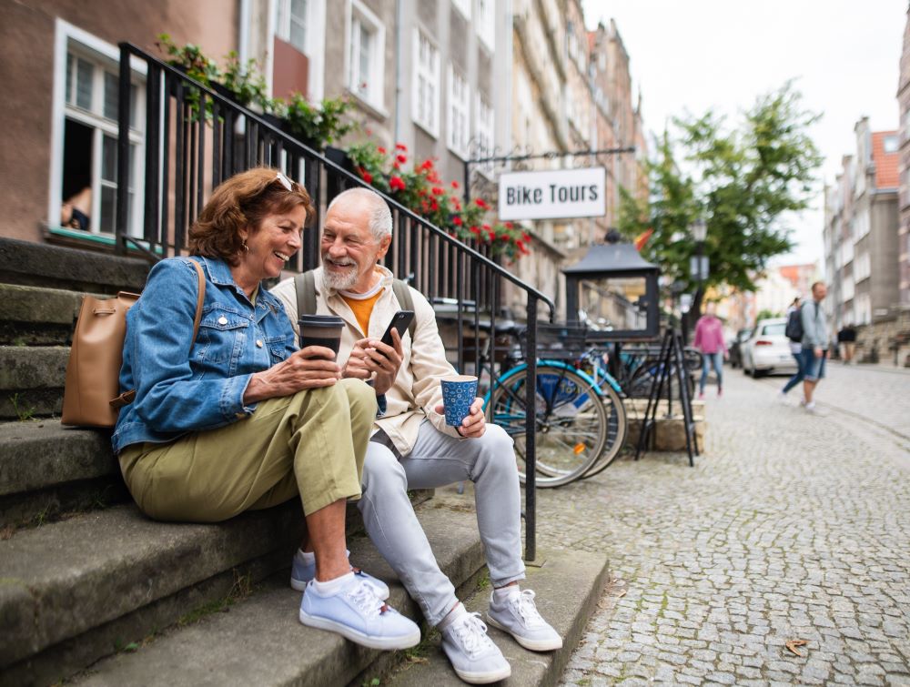 Senior couple taking a break on their walk